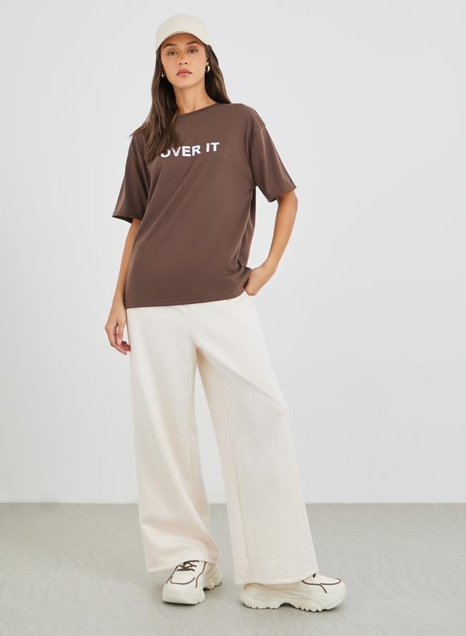Styli Women Brown Slogan Print Oversized T-Shirt - Image 2